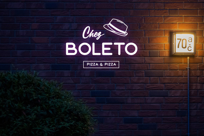 Logo Pizza Chez Boleto sur un mur de briques